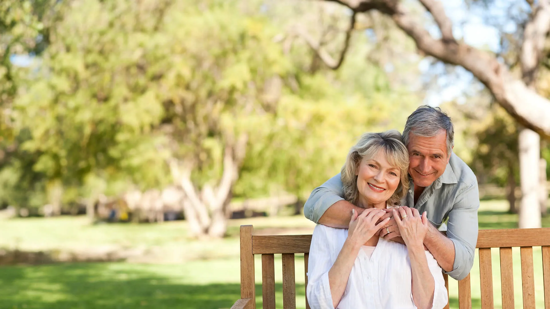 a man and woman sitting on a bench