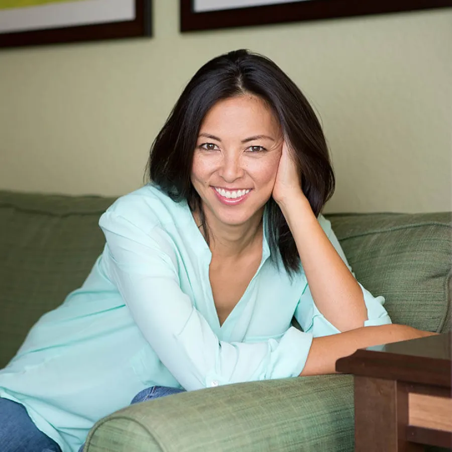 a woman sitting on a couch