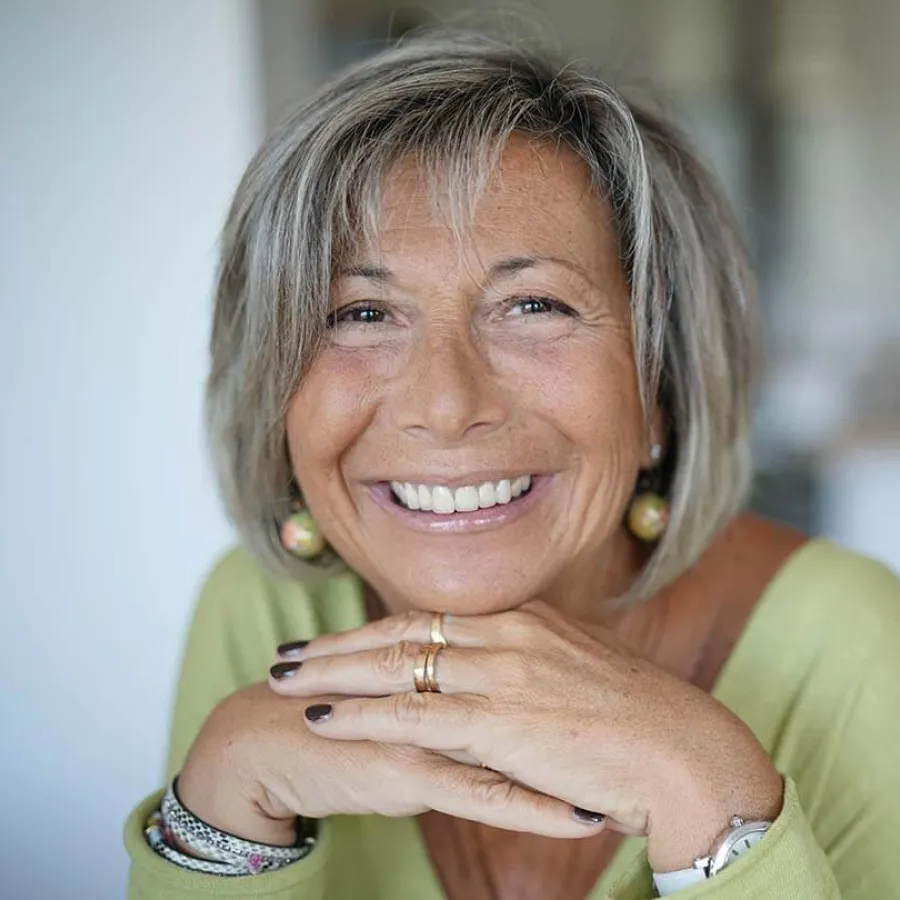 a woman with her hands together