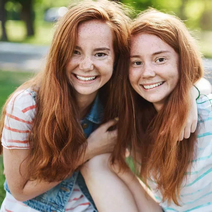 a couple of women embracing