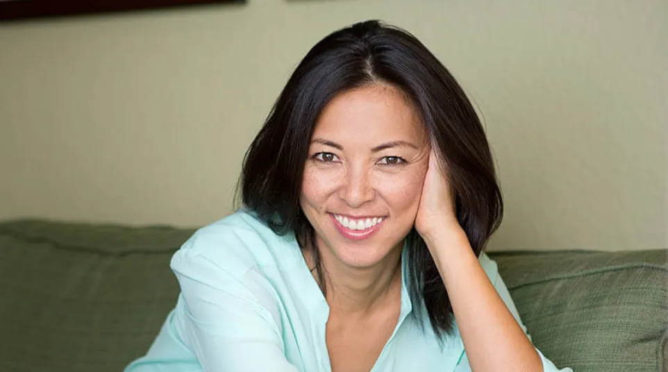 a woman sitting on a couch