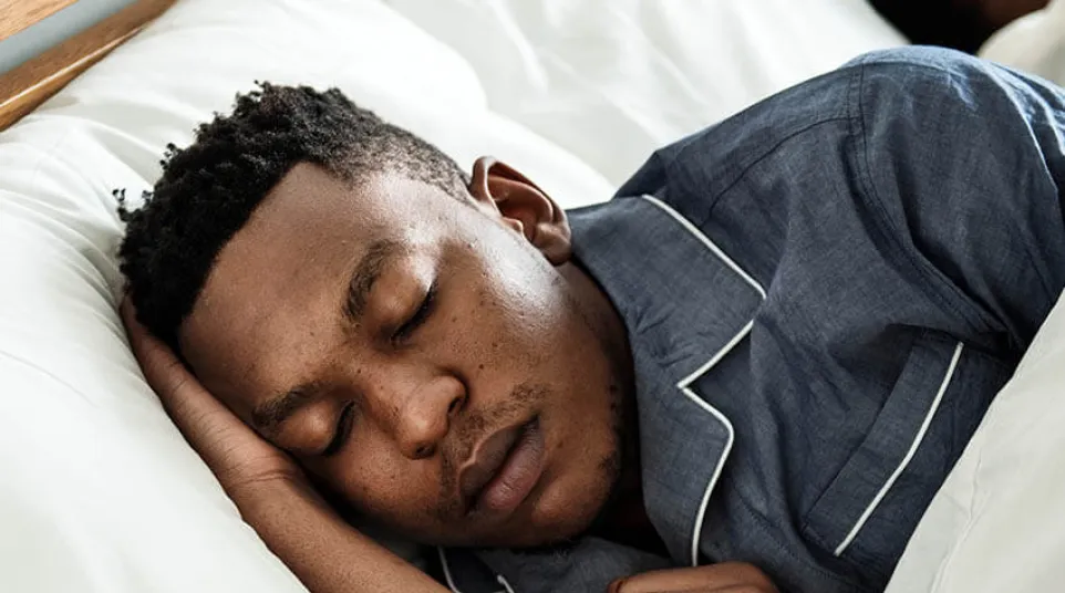 a man sleeping on a bed