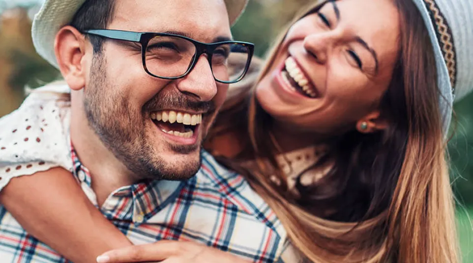 a man and woman smiling
