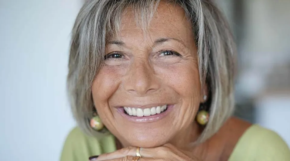 a woman with her hands together