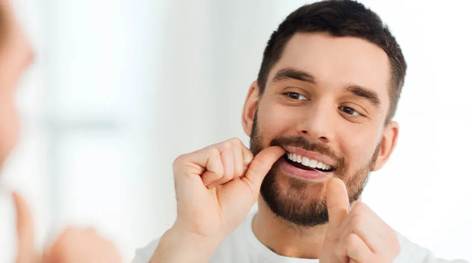 a man with his hands on his face